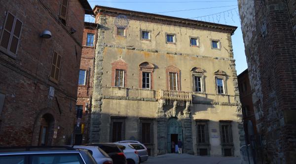  View of the main facade of Palazzo della Corgna, characterized by elegant relief decorations in pietra serena that enhance the historic building. 