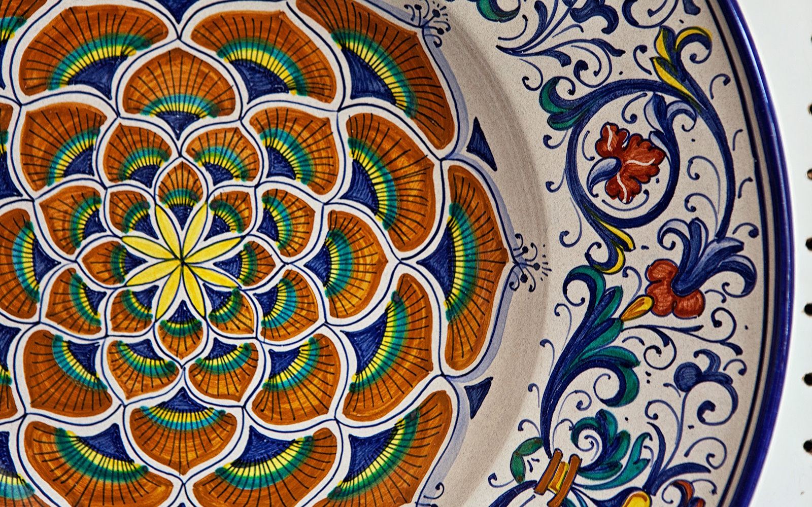 A detail of a Deruta ceramic with a typical floral decoration.